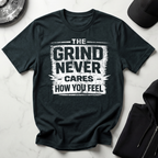 The Grind Never Cares Dark Tee