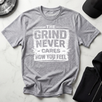 The Grind Never Cares Dark Tee